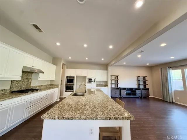 a kitchen with a table and chairs in it