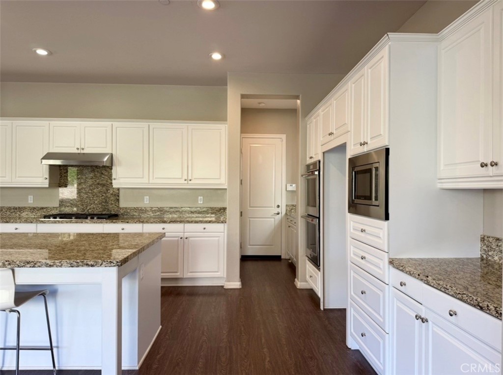 667 Desert Willow Road Azusa, CA 91702 - Photo 35 of 75 a kitchen with a stove a sink and a refrigerator