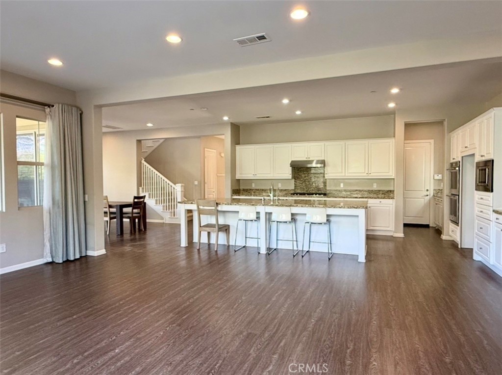 667 Desert Willow Road Azusa, CA 91702 - Photo 39 of 75 an open kitchen with a table and chairs