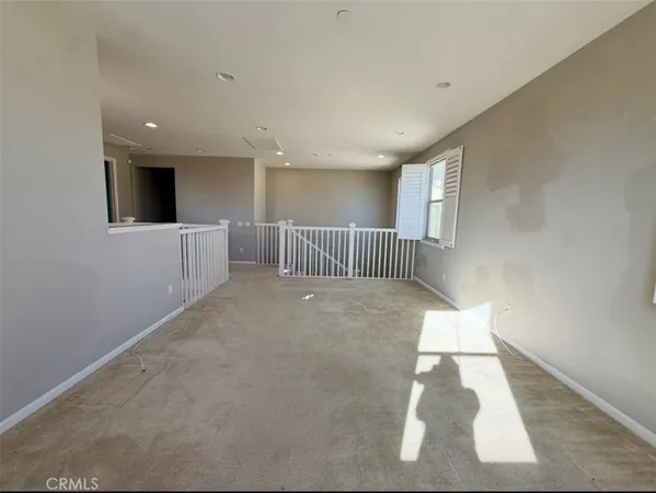 a spacious bathroom with a mirror a shower and a sink