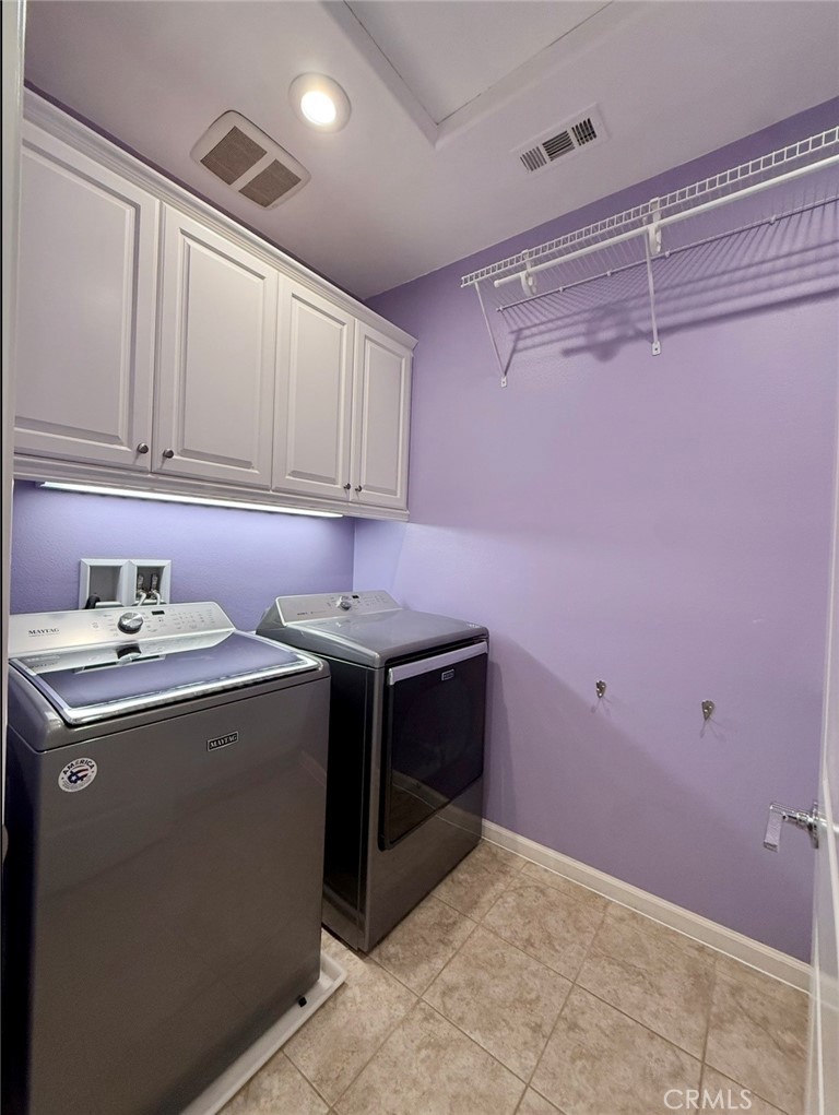 667 Desert Willow Road Azusa, CA 91702 - Photo 63 of 75 a utility room with cabinets washer and dryer
