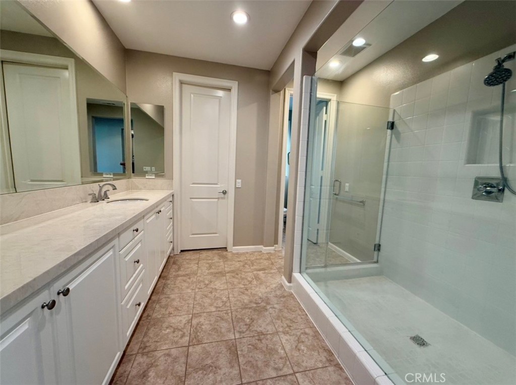 667 Desert Willow Road Azusa, CA 91702 - Photo 66 of 75 a bathroom with a double vanity sink toilet and shower