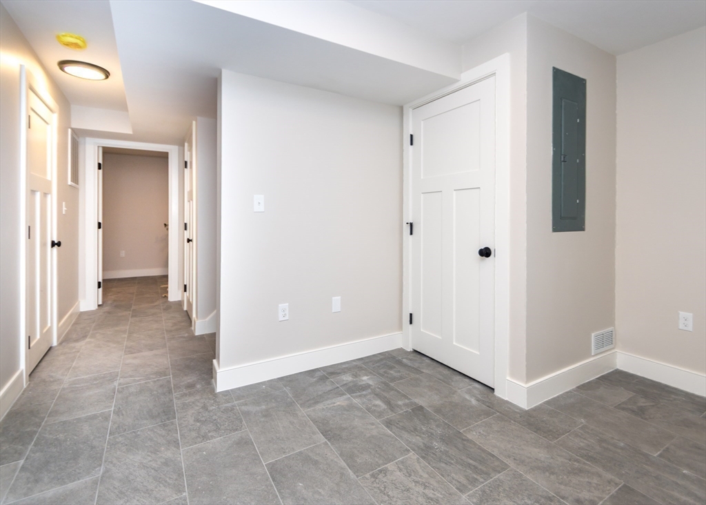 89 Hardy Pond Road Waltham, MA 02451 - Photo 30 of 39 a view of a bathroom with a shower and a sink