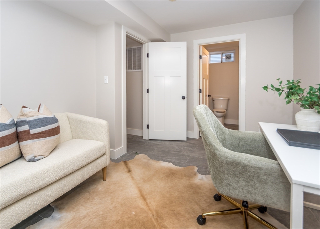 89 Hardy Pond Road Waltham, MA 02451 - Photo 34 of 39 a living room with furniture and a potted plant