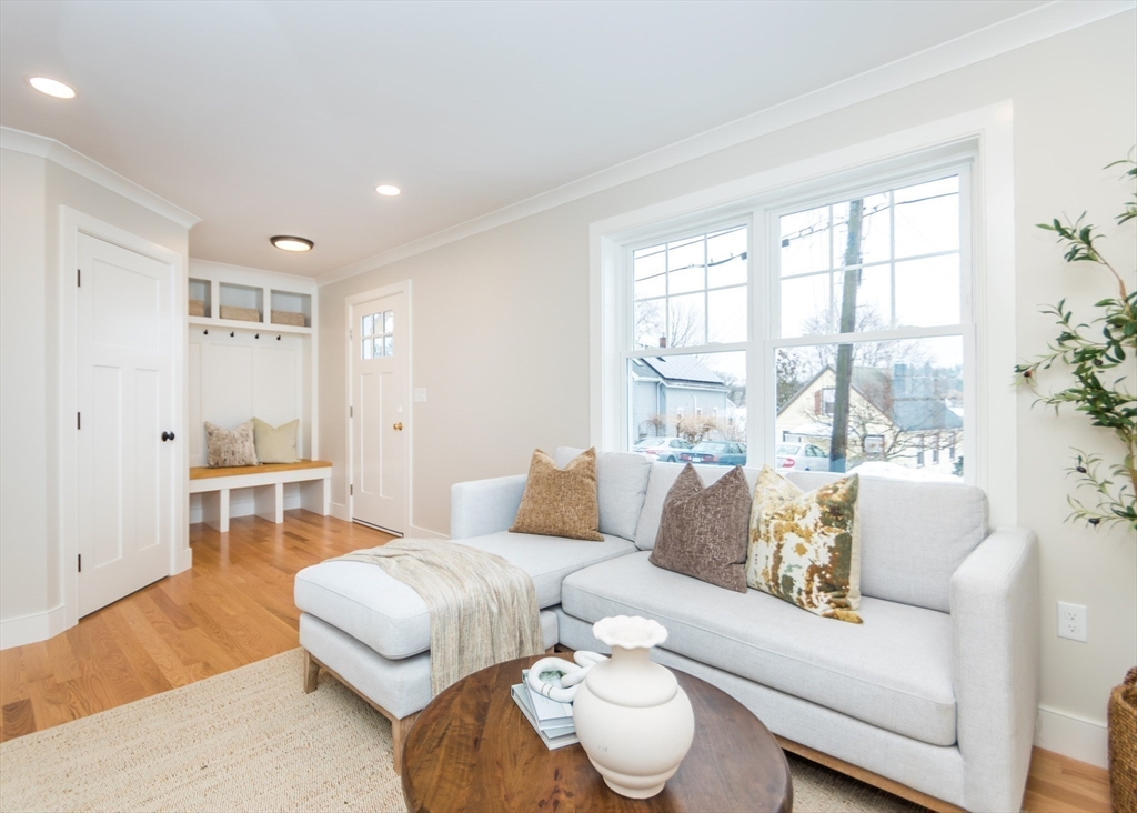 89 Hardy Pond Road Waltham, MA 02451 - Photo 5 of 39 a living room with furniture and a large window