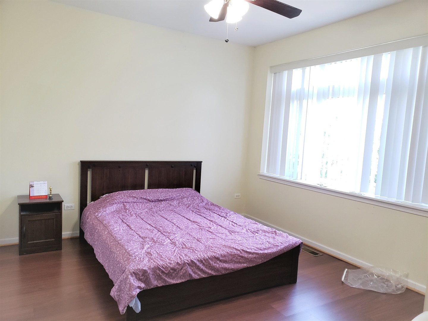 3554 South Dearborn Street Chicago, IL 60609 - Photo 11 of 22 a bedroom with a bed and window