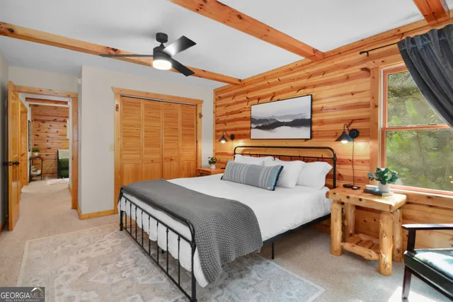 a bedroom with furniture and a window