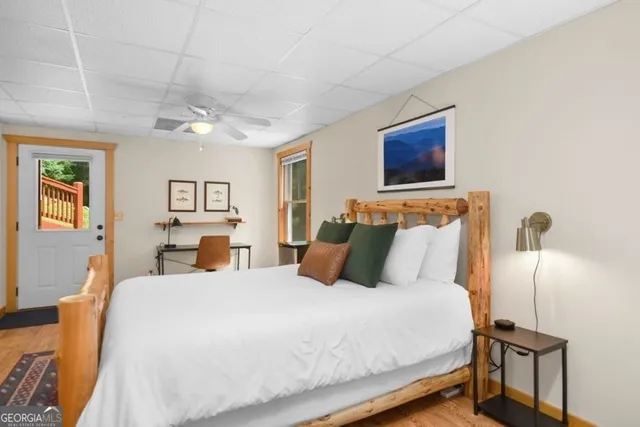 a bedroom with a bed and a chandelier