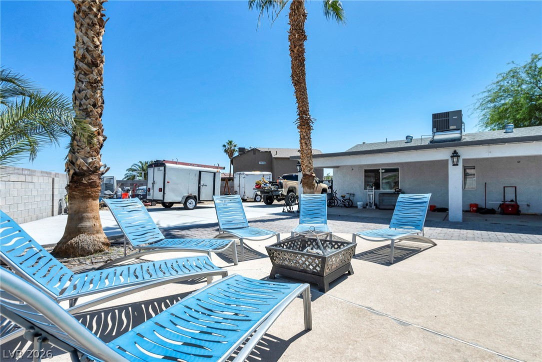 5882 Rio Tinto Way Las Vegas, NV 89110 - Photo 43 of 56 Lounge in leisure around the fire pit on this generously paved patio, perfect for outdoor relaxation.