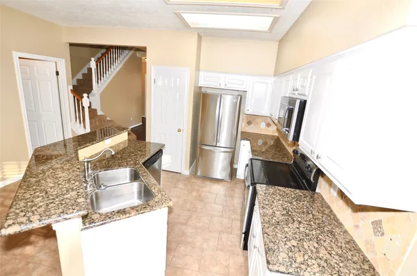 a view of a living room with furniture