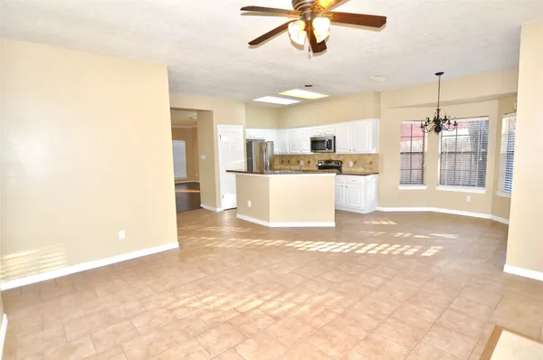 a view of a kitchen with appliances and cabinets