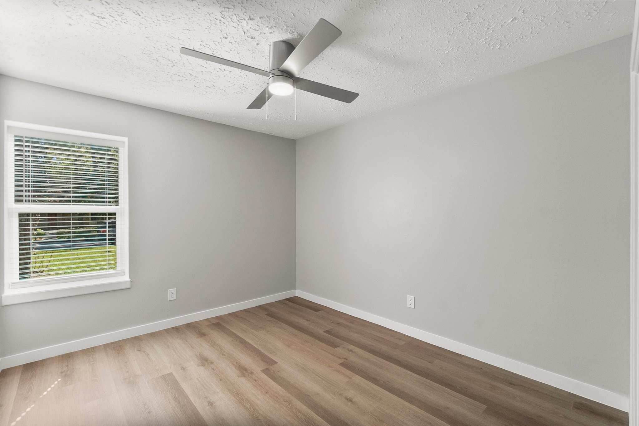 22907 Lemon Grove Drive Spring, TX 77373 - Photo 21 of 30 wooden floor in an empty room with a window