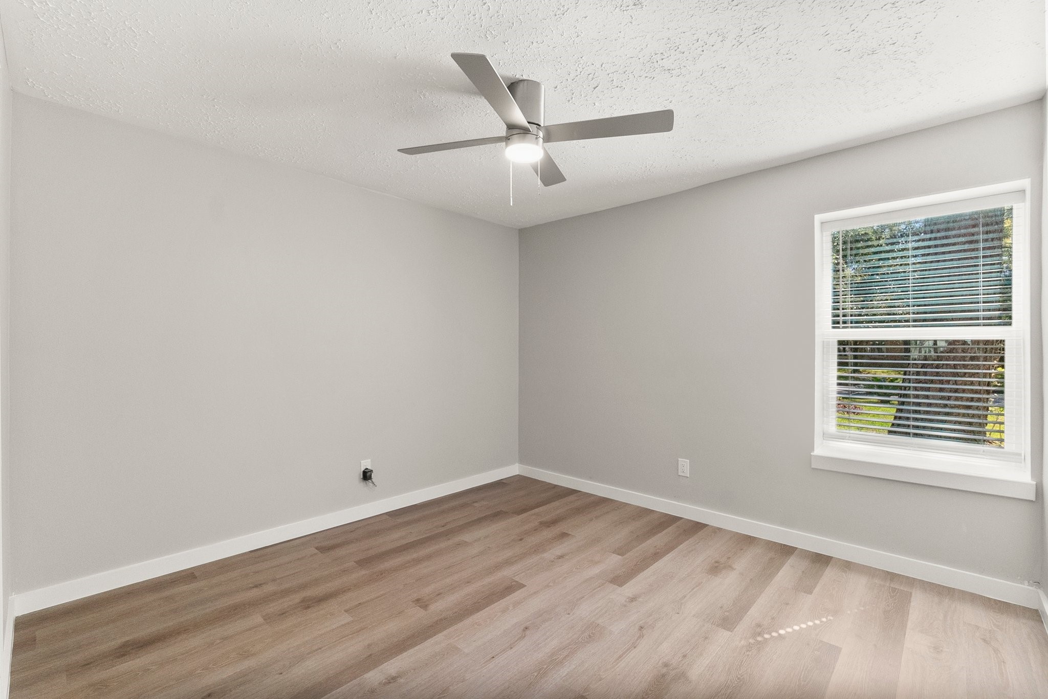 22907 Lemon Grove Drive Spring, TX 77373 - Photo 23 of 30 wooden floor in an empty room with a window