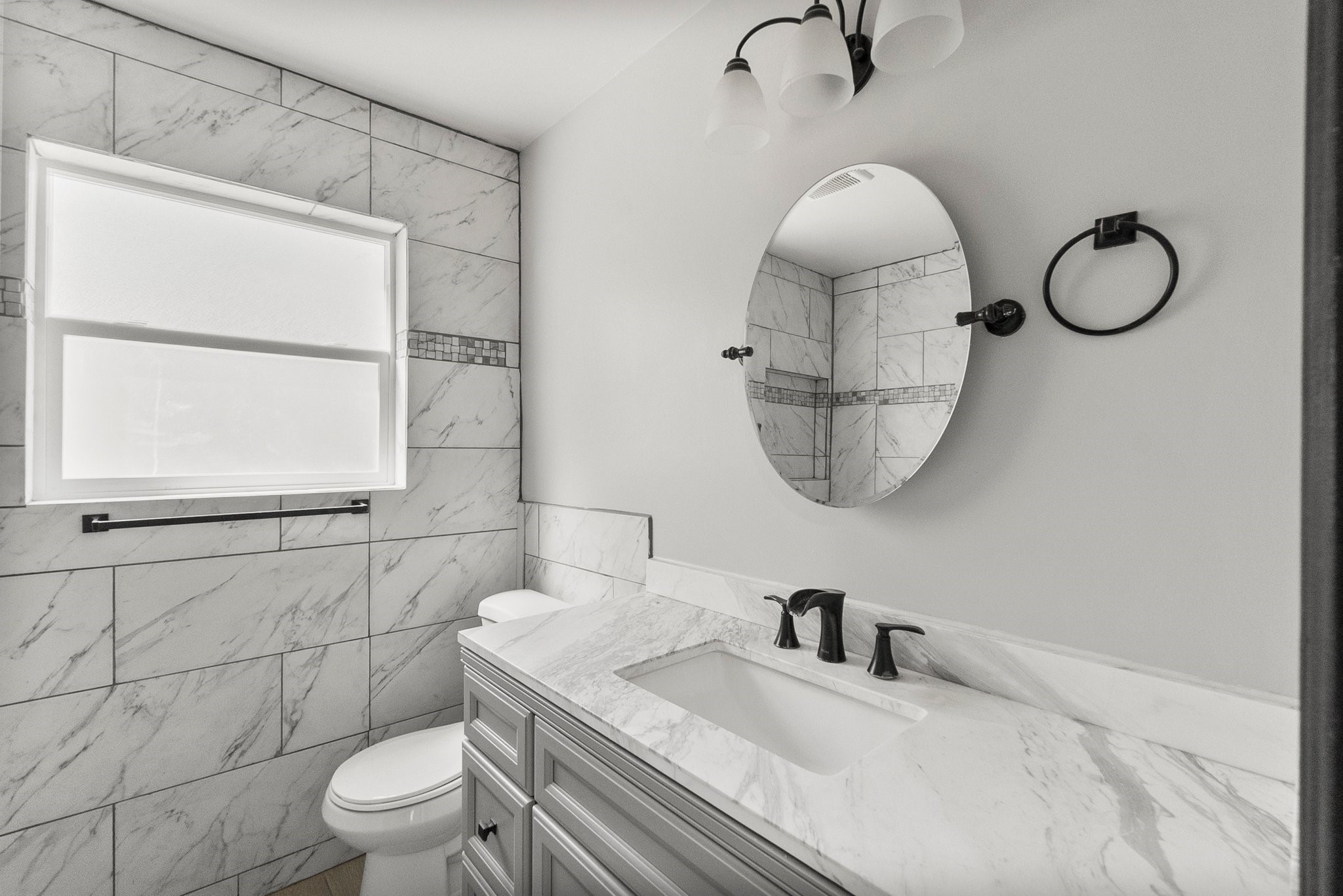 22907 Lemon Grove Drive Spring, TX 77373 - Photo 25 of 30 a bathroom with a granite countertop sink mirror vanity and toilet