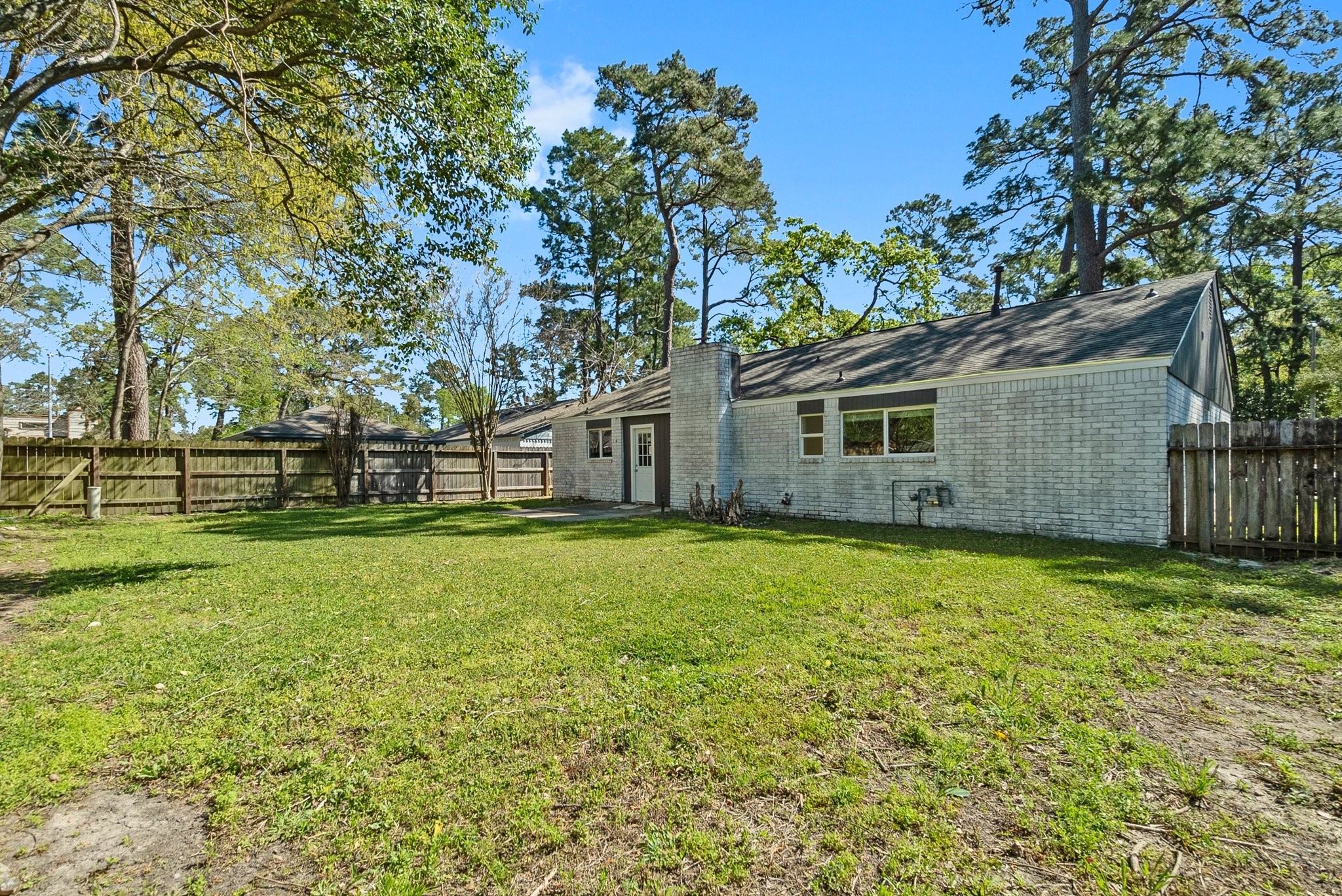 22907 Lemon Grove Drive Spring, TX 77373 - Photo 29 of 30 a backyard of a house with lots of green space and fountain
