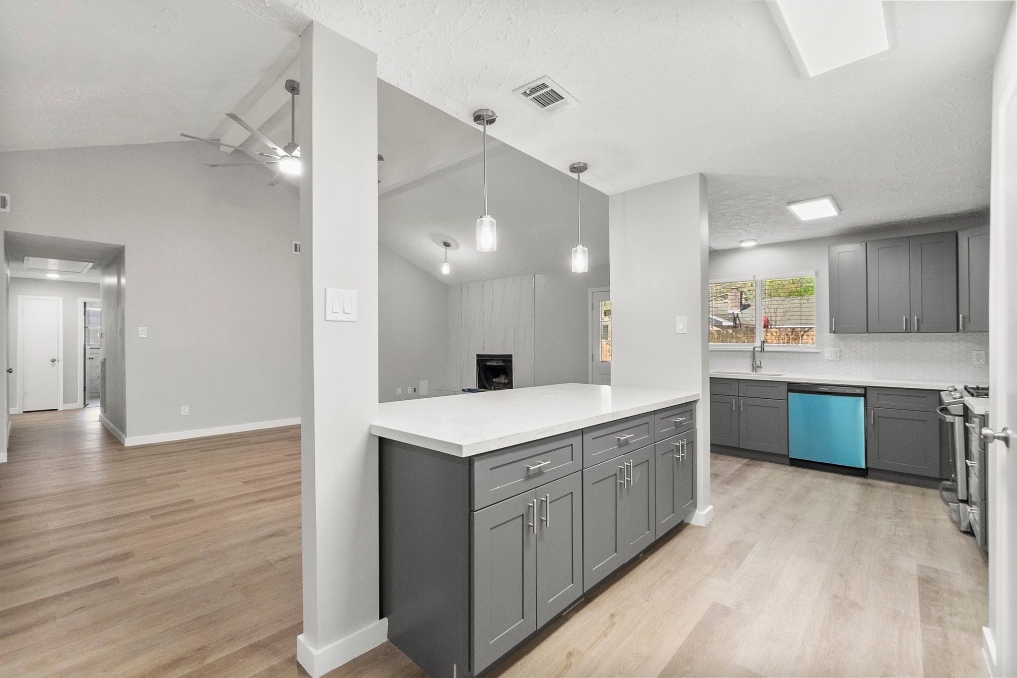 22907 Lemon Grove Drive Spring, TX 77373 - Photo 10 of 30 a large kitchen with a lot of counter space and wooden floor