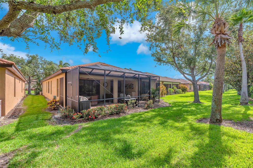 321 Silver Falls Drive Apollo Beach, FL 33572 - Photo 2 of 51 a view of a house with backyard and a tree