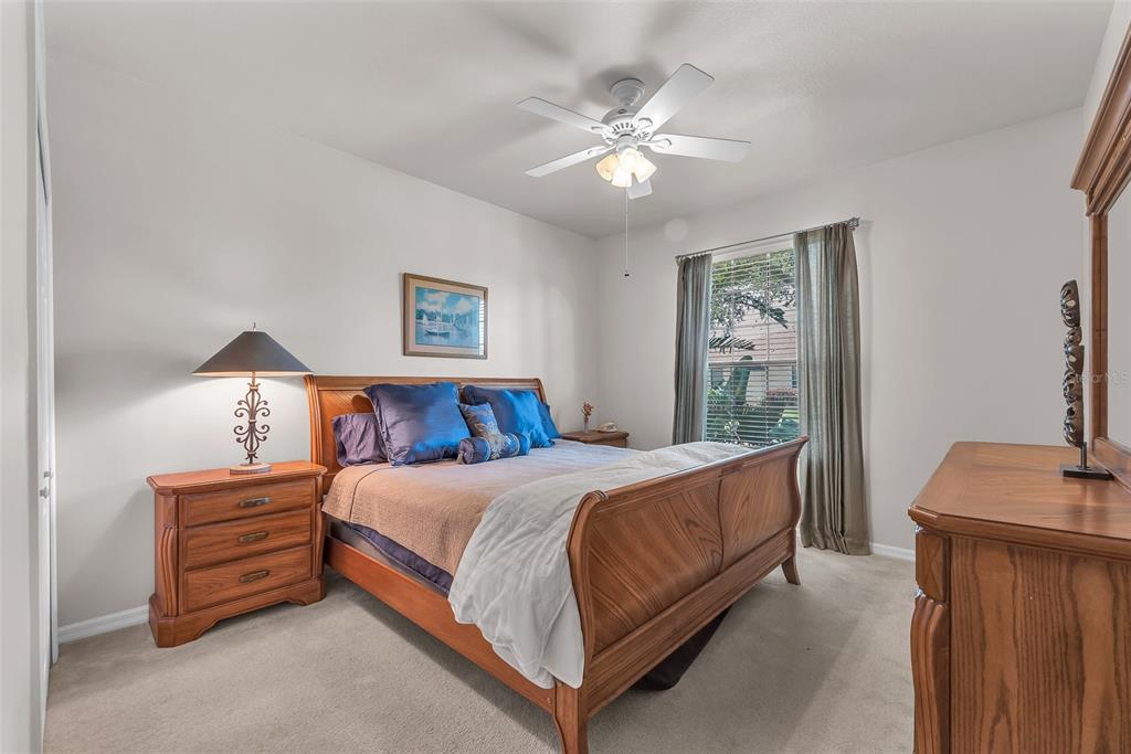 321 Silver Falls Drive Apollo Beach, FL 33572 - Photo 21 of 51 a bed room with a bed and a lamp