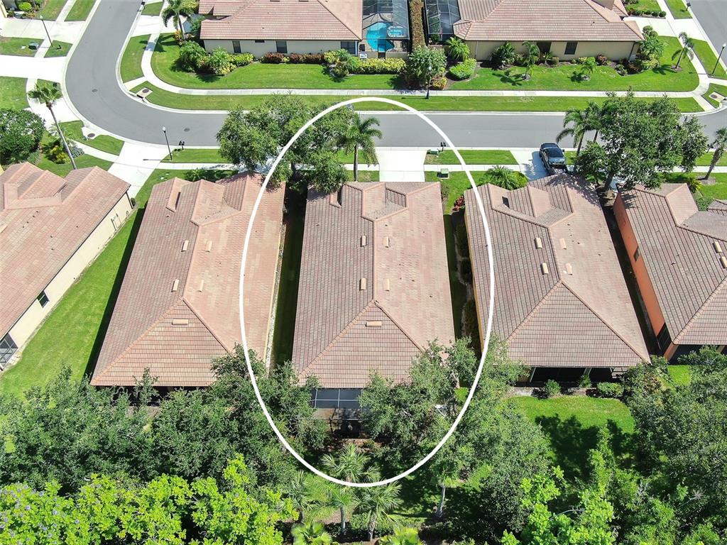 321 Silver Falls Drive Apollo Beach, FL 33572 - Photo 26 of 51 an aerial view of a house with a yard and potted plants