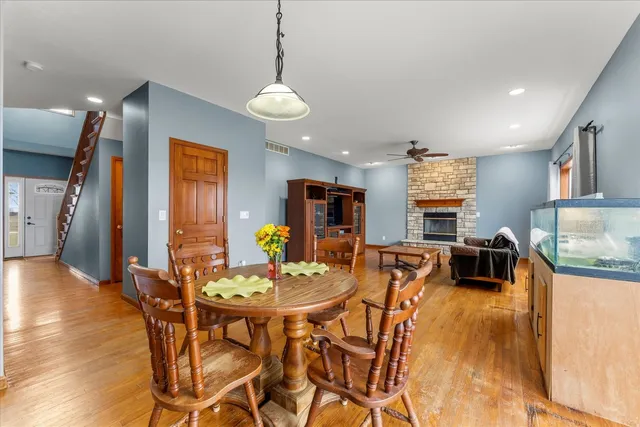 a view of a dining room with furniture and a chandelier