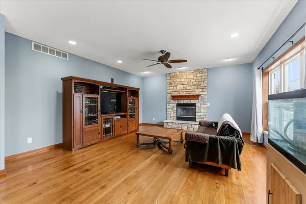 a living room with furniture window and wooden floor