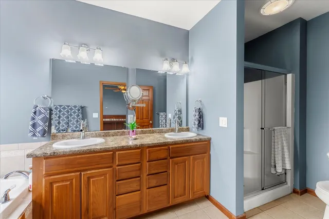 a bathroom with a sink double vanity and a mirror