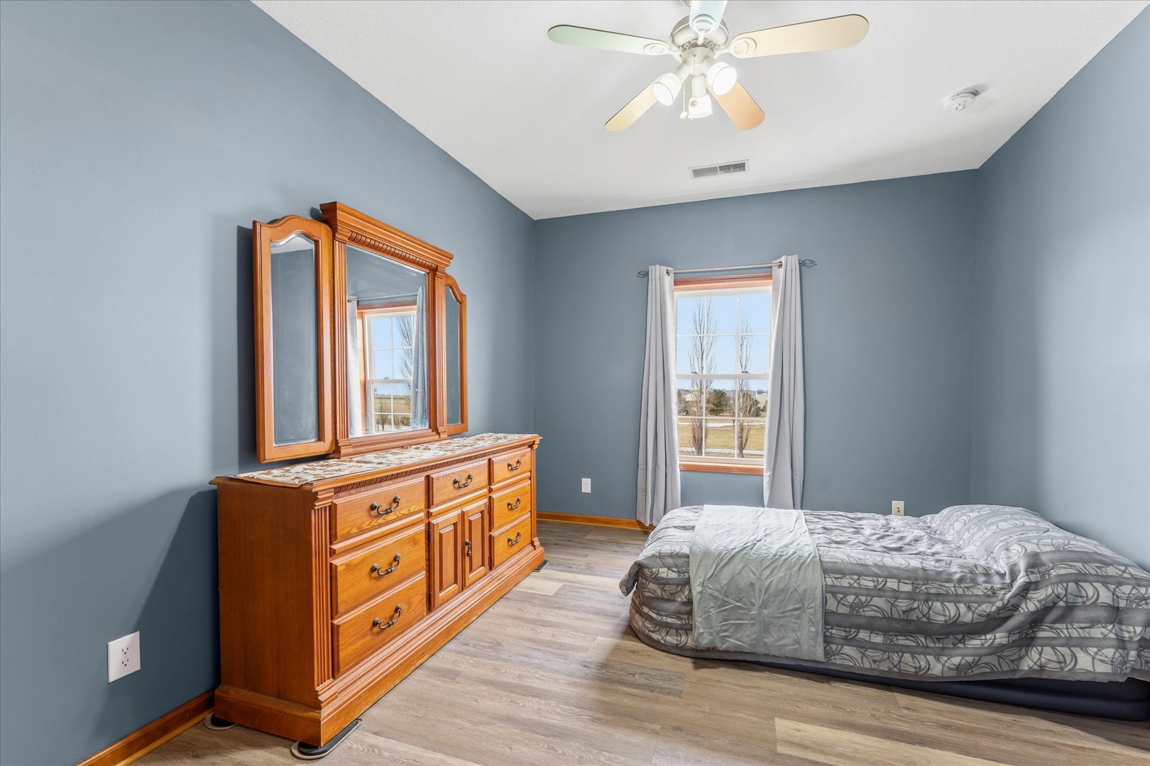 1376 East 2950 North Road Mansfield, IL 61854 - Photo 30 of 44 a living room with a bed next to a window