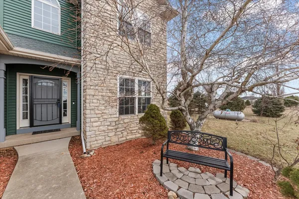 a view of a bench in a backyard