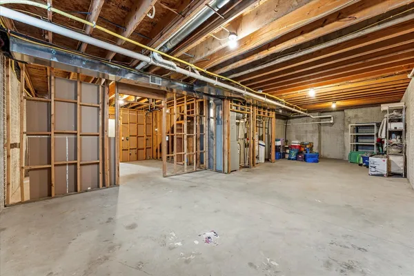 a view of empty room with wooden ceiling