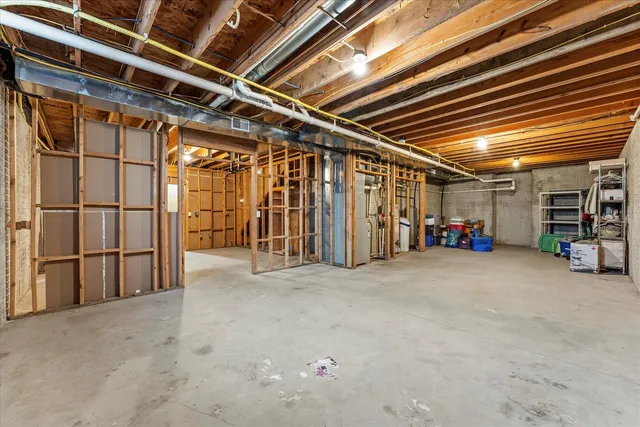 a view of empty room with wooden ceiling