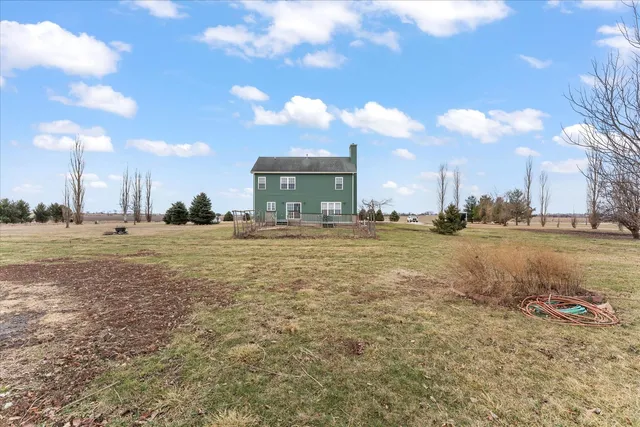 a view of a town with floor to ceiling windows