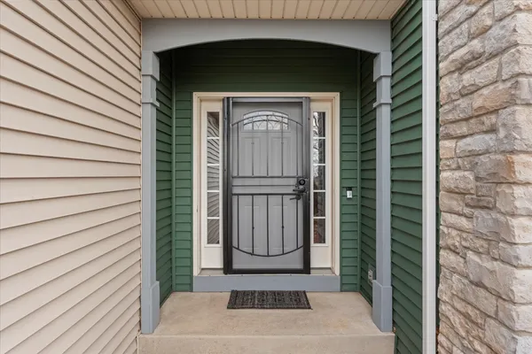 a view of entryway with a door
