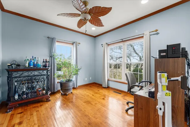 a bedroom with furniture and a window