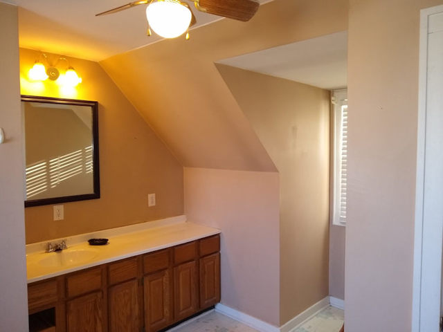339 North 12th Street Rochelle, IL 61068 - Photo 14 of 18 a bathroom with a sink and a mirror