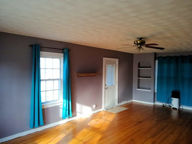 339 North 12th Street Rochelle, IL 61068 - Photo 8 of 18 a bedroom with a bed and a chair
