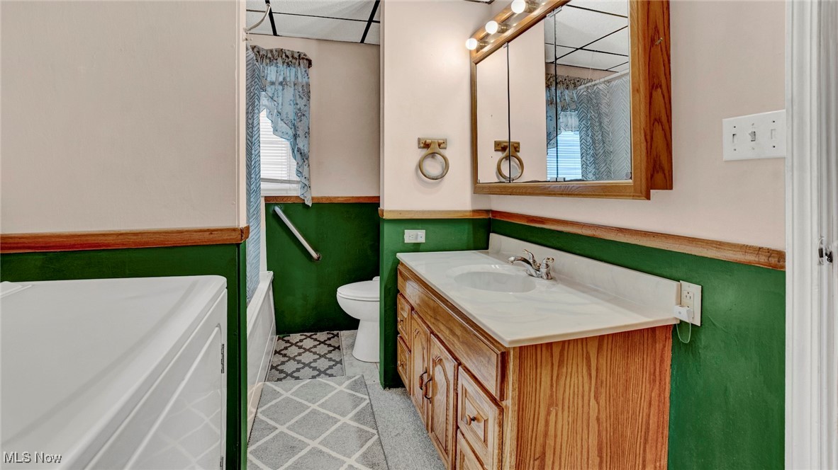 337 Pomerene Road Mansfield, OH 44906 - Photo 4 of 32 Bathroom with vanity, toilet, and washer / dryer