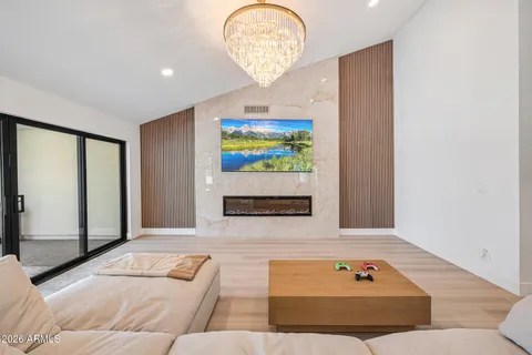 a living room with furniture and a large window