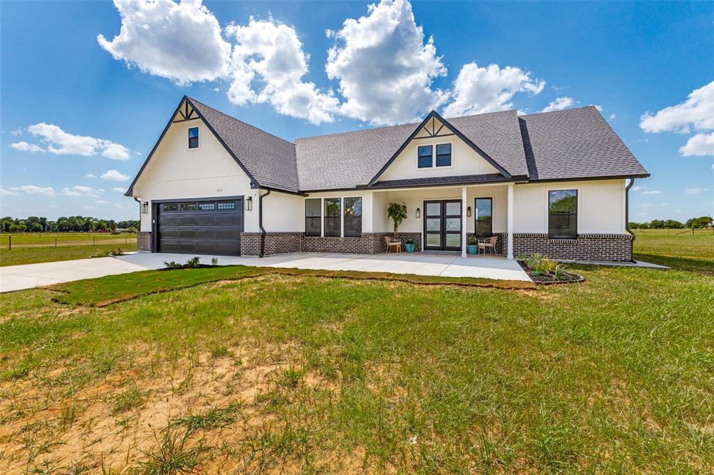 3150 Crisp Road Ennis, TX 75119 - Photo 2 of 30 Modern farmhouse exterior featuring white siding and dark brick accents