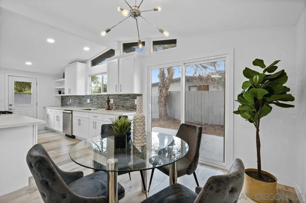 13746 Frame Road Poway, CA 92064 - Photo 16 of 35 a dining room filled chandelier and kitchen view
