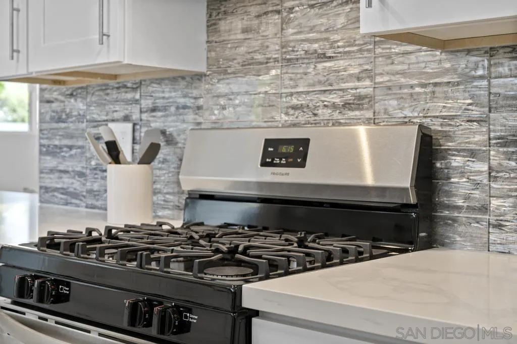 13746 Frame Road Poway, CA 92064 - Photo 19 of 35 a stove top oven sitting inside of a kitchen