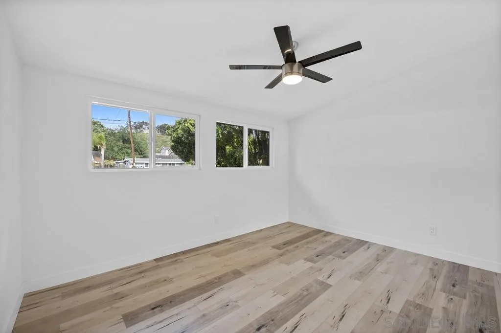 13746 Frame Road Poway, CA 92064 - Photo 24 of 35 a view of a big room with wooden floor closet and windows