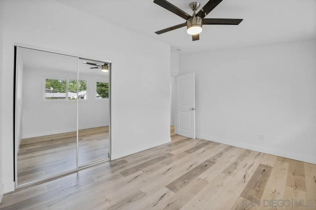 13746 Frame Road Poway, CA 92064 - Photo 25 of 35 a view of an empty room with wooden floor