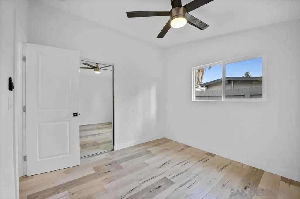 13746 Frame Road Poway, CA 92064 - Photo 26 of 35 a view of a room with wooden floor and ceiling fan