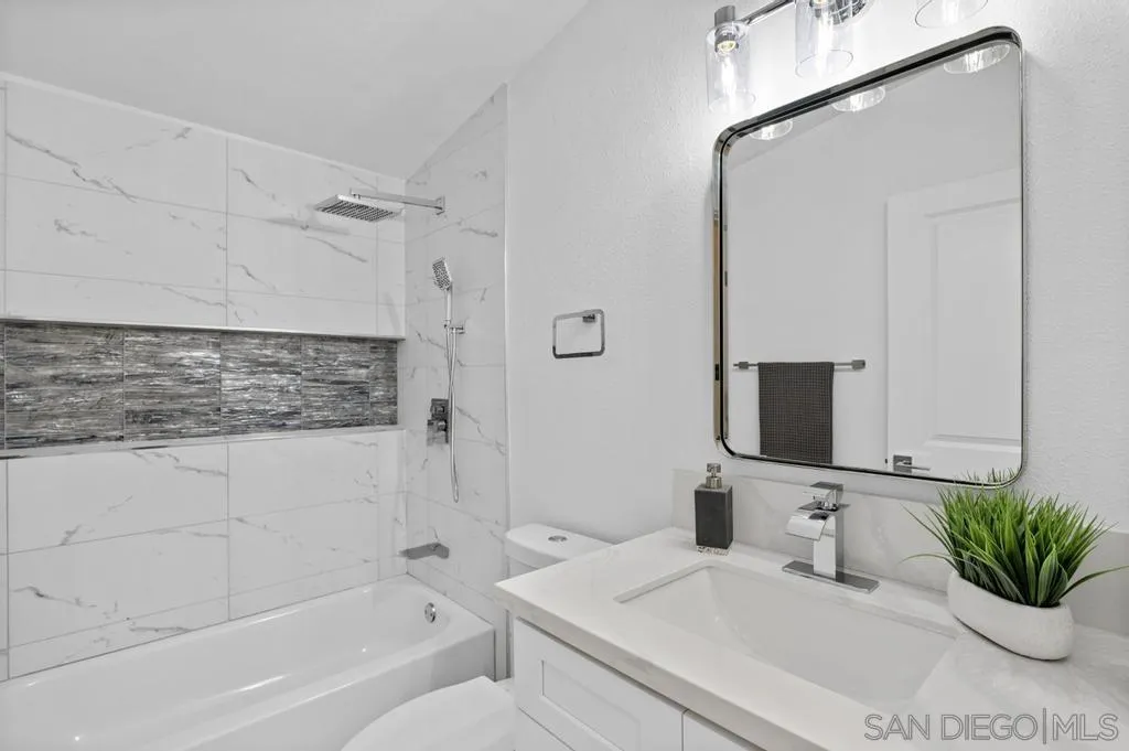 13746 Frame Road Poway, CA 92064 - Photo 6 of 35 a bathroom with a sink a toilet a mirror and shower