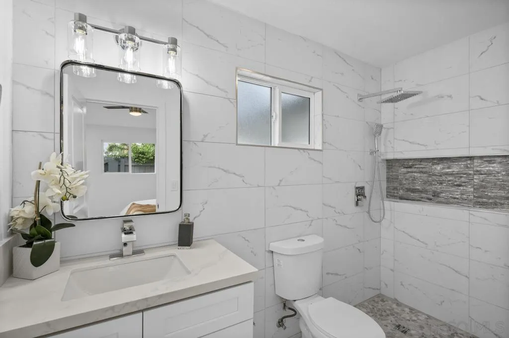 13746 Frame Road Poway, CA 92064 - Photo 8 of 35 a bathroom with a sink toilet and shower