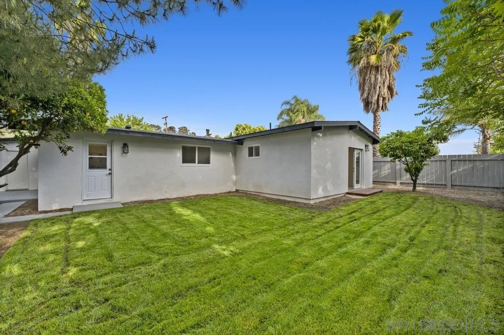 13746 Frame Road Poway, CA 92064 - Photo 9 of 35 a white house with green field in front of it
