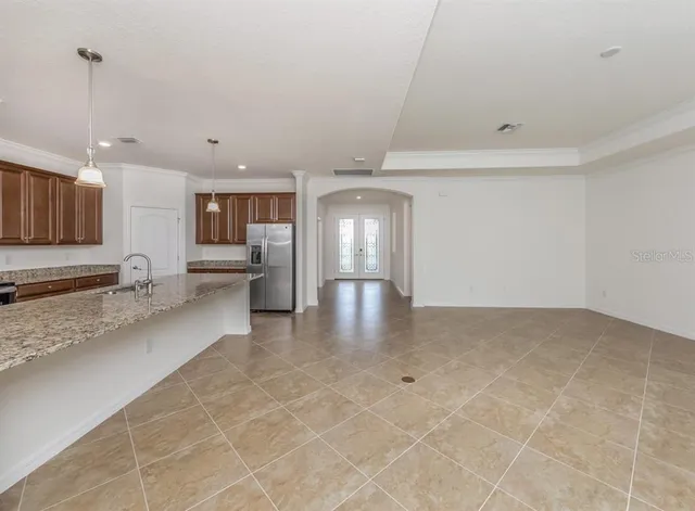 a view of a kitchen with a sink and cabinets