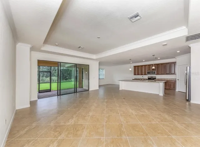 a view of kitchen with furniture and window