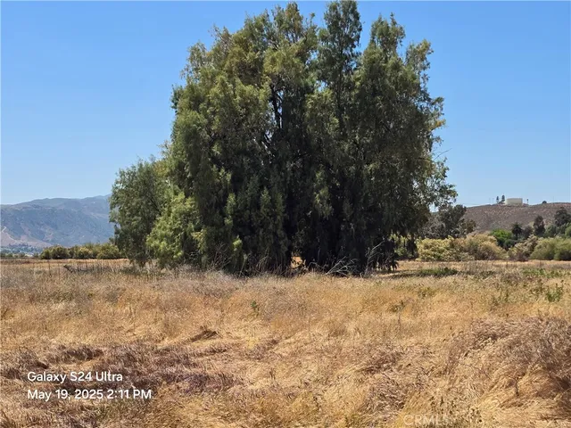 a view of yard covered with snow in front of house