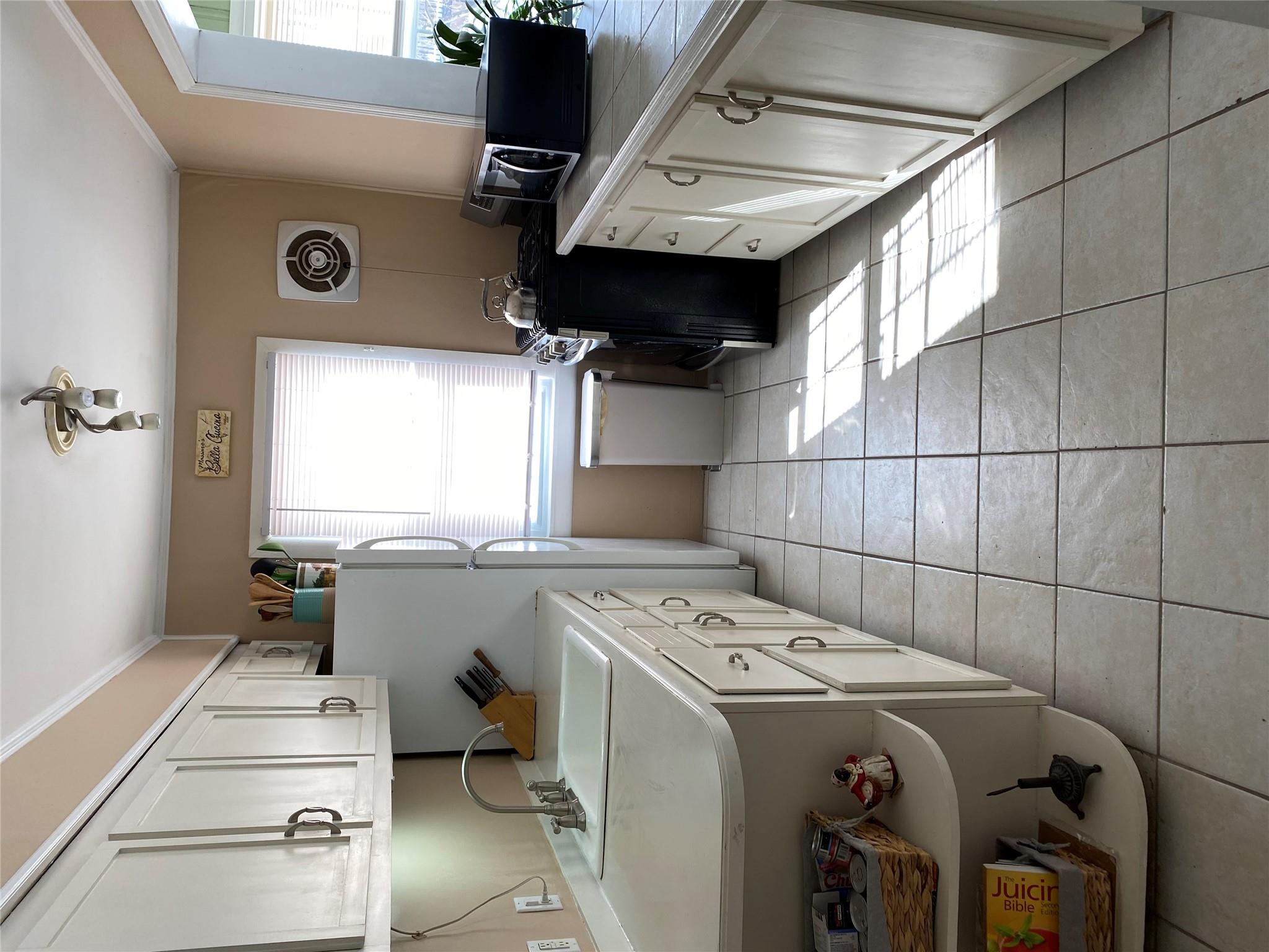 168 Prospect Road Monroe, NY 10950 - Photo 7 of 15 Kitchen with visible vents, ornamental molding, a sink, light countertops, and range